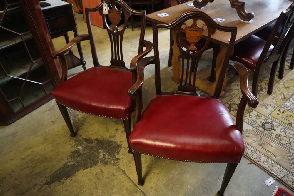 A set of eight George III inlaid mahogany dining chairs (2 with arms)